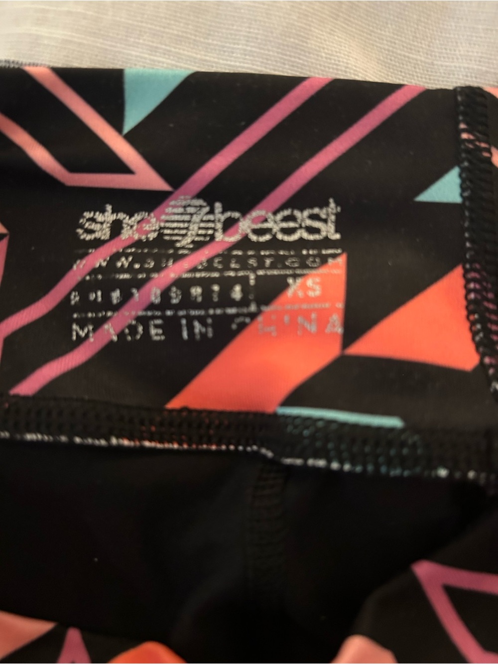 shebeest Black Bike Shorts with Coral, Teal & Pink Geometric Trim - Picture 5 of 6